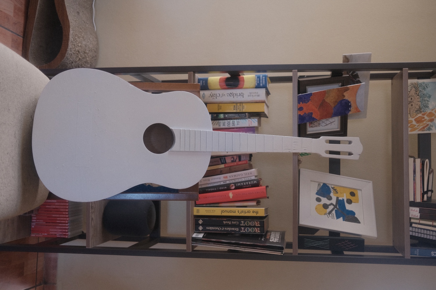 The guitar with it's white primer