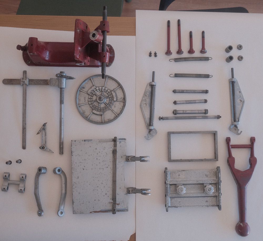 All the pieces laid out on the table after being cleaned